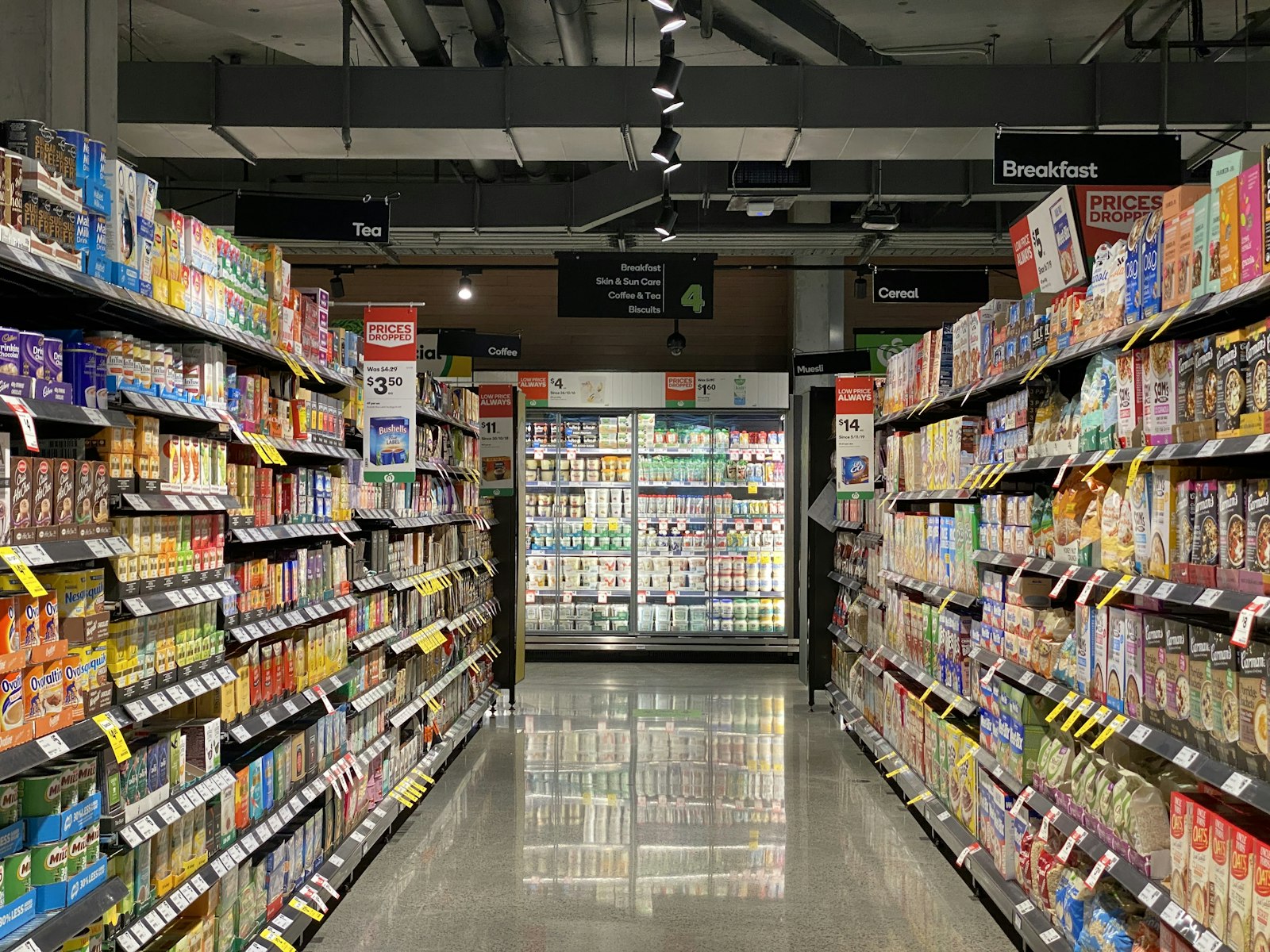 Well-stocked retail store aisle lined with products on shelves